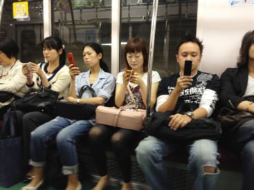 Passengers on the Tokyo subway can regularly be found glued to their mobile devices.